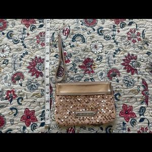 Express gold sequin clutch.